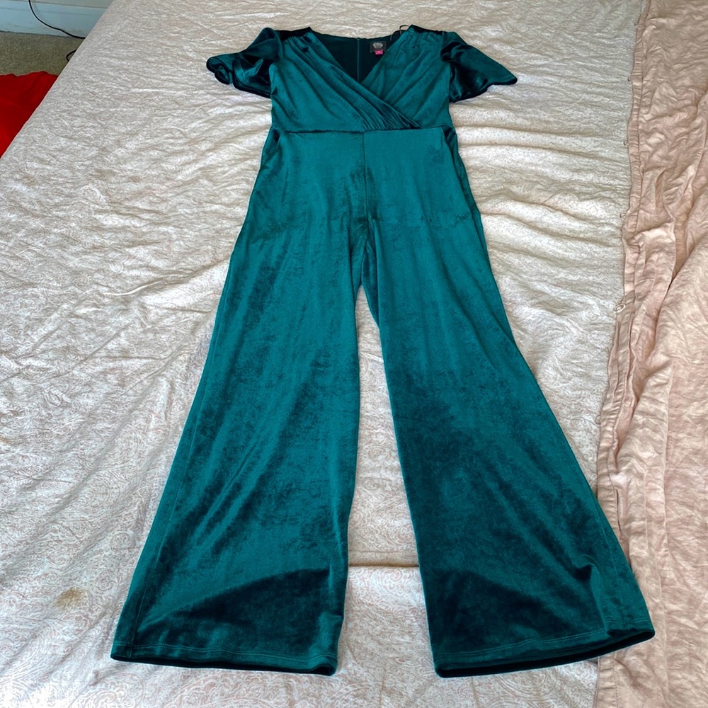 Green velvet jumpsuit with pockets, belt, and cap sleeves